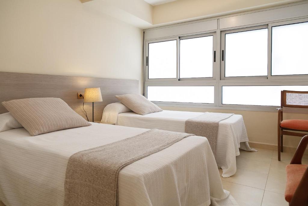 Postel nebo postele na pokoji v ubytování UHC RODAS APARTMENTS