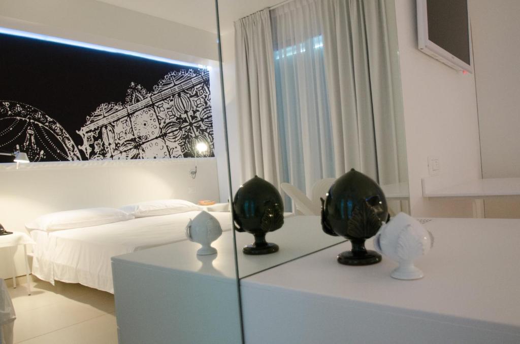 Postel nebo postele na pokoji v ubytování QuiHotel