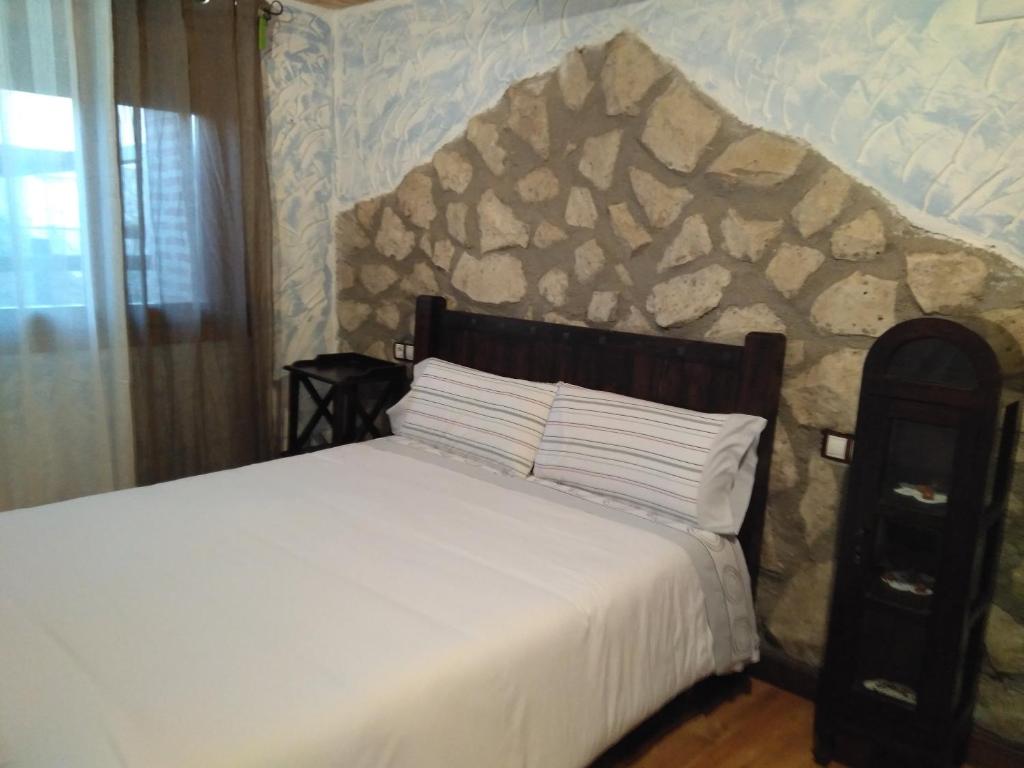 A bed or beds in a room at Apartamentos Turisticos Julia