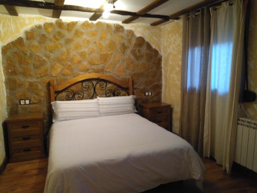 A bed or beds in a room at Apartamentos Turisticos Julia