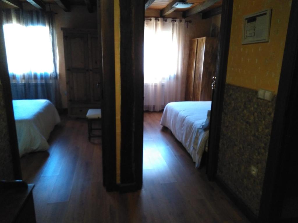A bed or beds in a room at Apartamentos Turisticos Julia