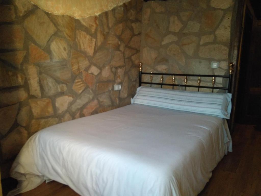 A bed or beds in a room at Apartamentos Turisticos Julia