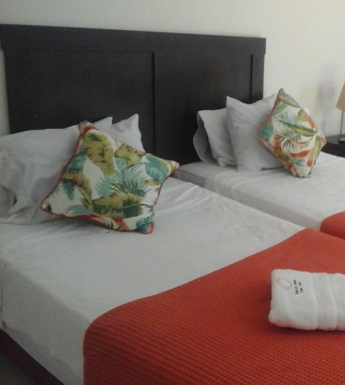 Postel nebo postele na pokoji v ubytování Sol de Luque Casa-hotel