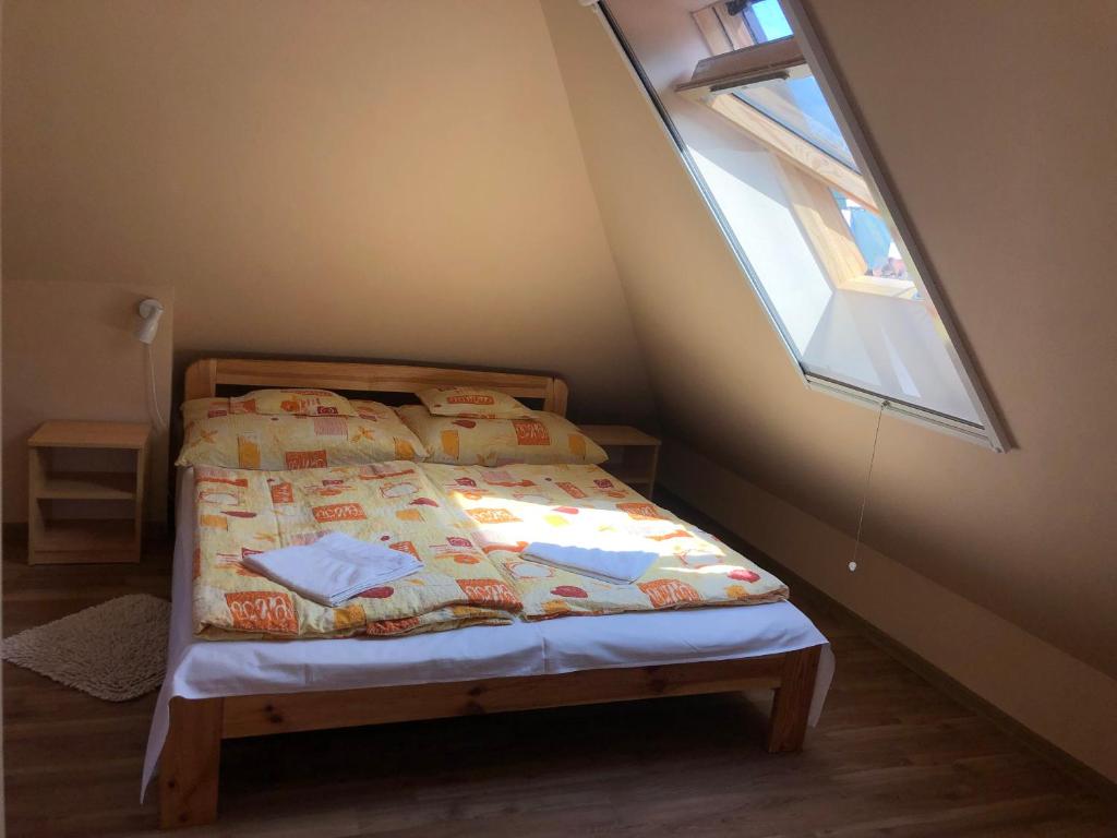 Postel nebo postele na pokoji v ubytování Óvár 12 Vendégház