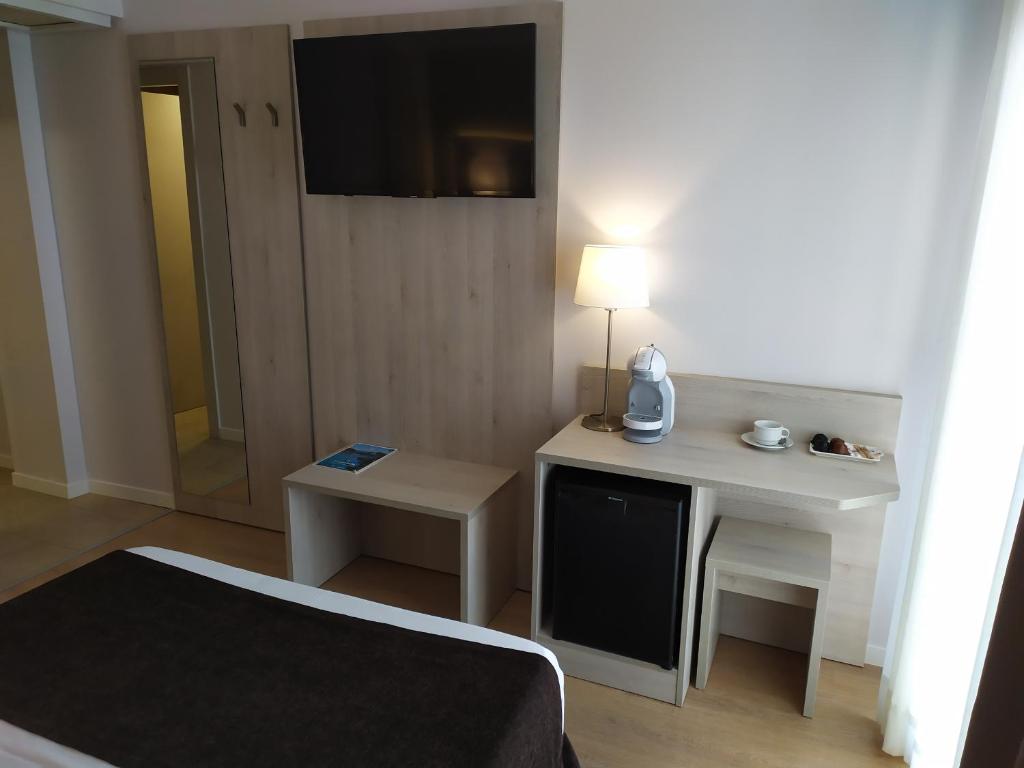 Postel nebo postele na pokoji v ubytování Hotel Helios Lloret