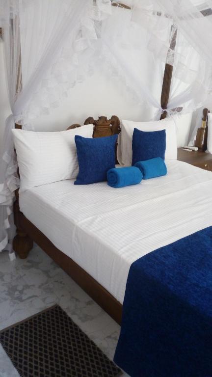 Letto o letti in una camera di Suriya Homestay Mirissa