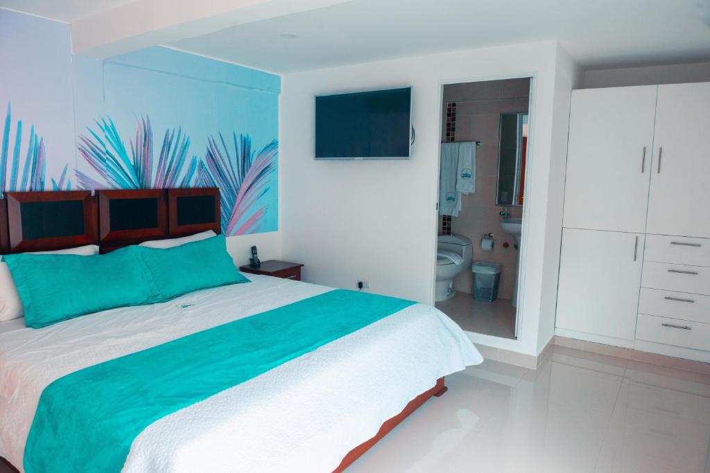 Postel nebo postele na pokoji v ubytování Hotel Casa Arnaldo "Esmeraldas"
