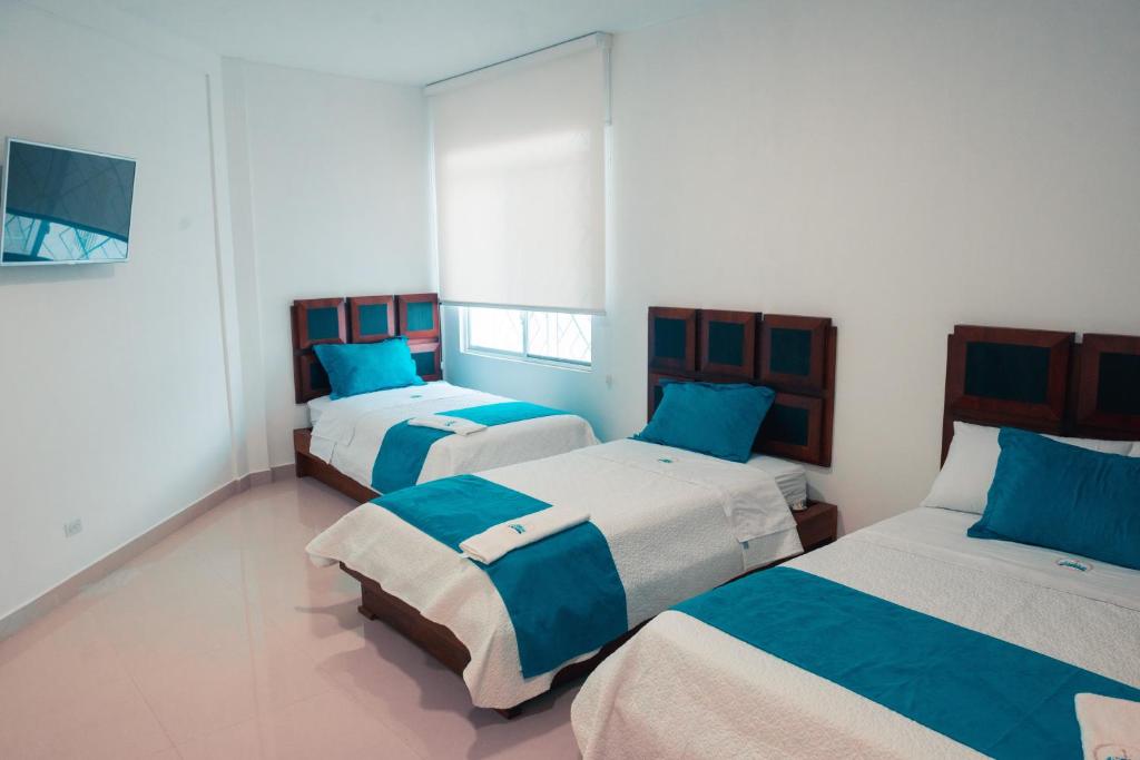 Postel nebo postele na pokoji v ubytování Hotel Casa Arnaldo "Esmeraldas"