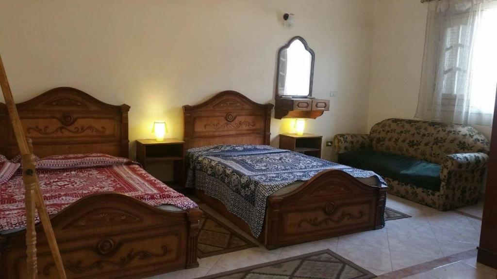 Tempat tidur dalam kamar di Elegant Heliopolis, Studio-apartment