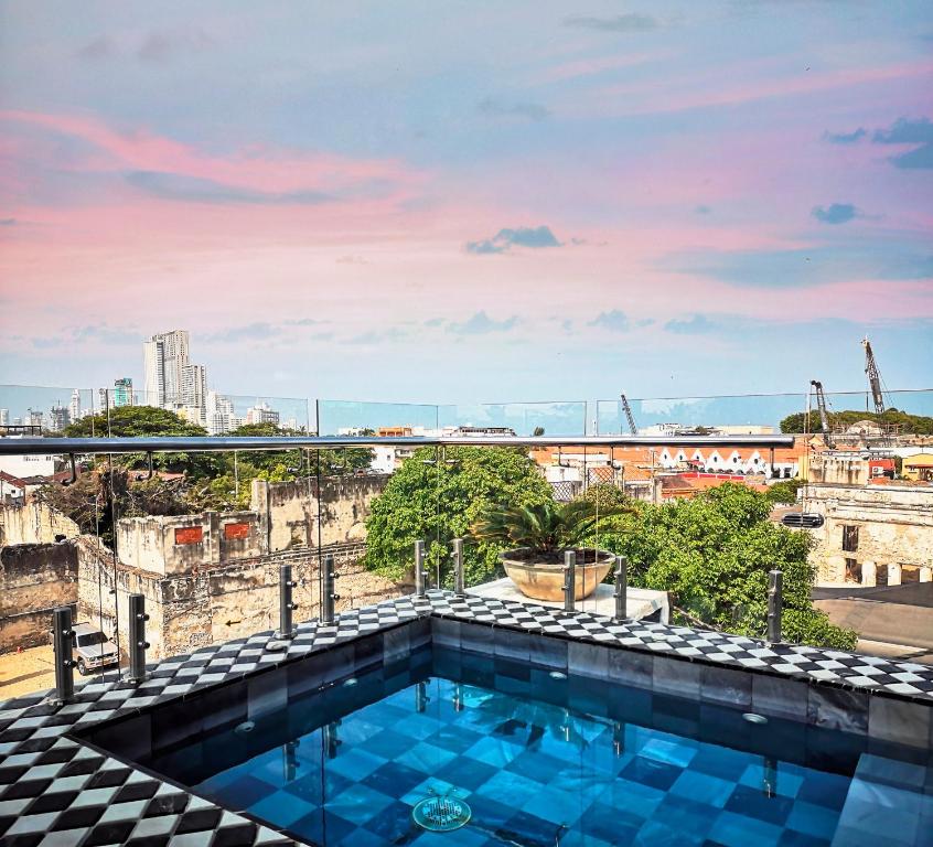 a view from the roof of a building with a swimming pool at Hotel Monaguillo de Getsemaní in Cartagena de Indias