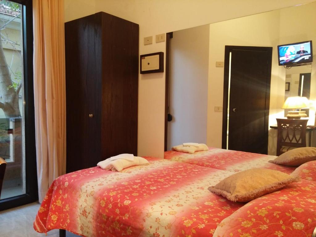 Postel nebo postele na pokoji v ubytování Hotel Memory