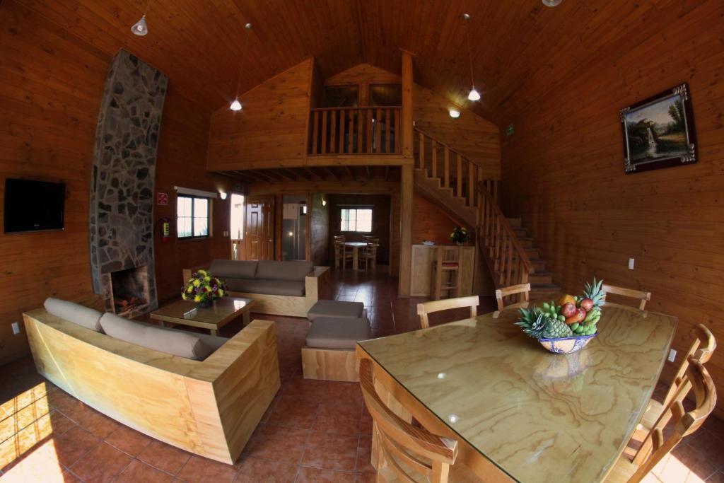 Posezení v ubytování Cabañas Molino del Rey
