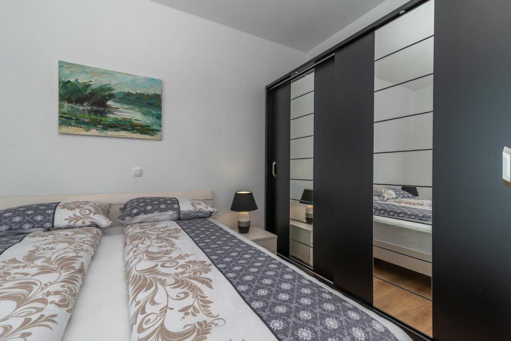 Postel nebo postele na pokoji v ubytování Villa Confido Luxury Apartment 01