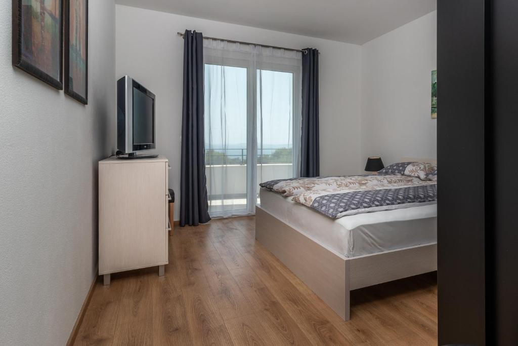 Postel nebo postele na pokoji v ubytování Villa Confido Luxury Apartment 01