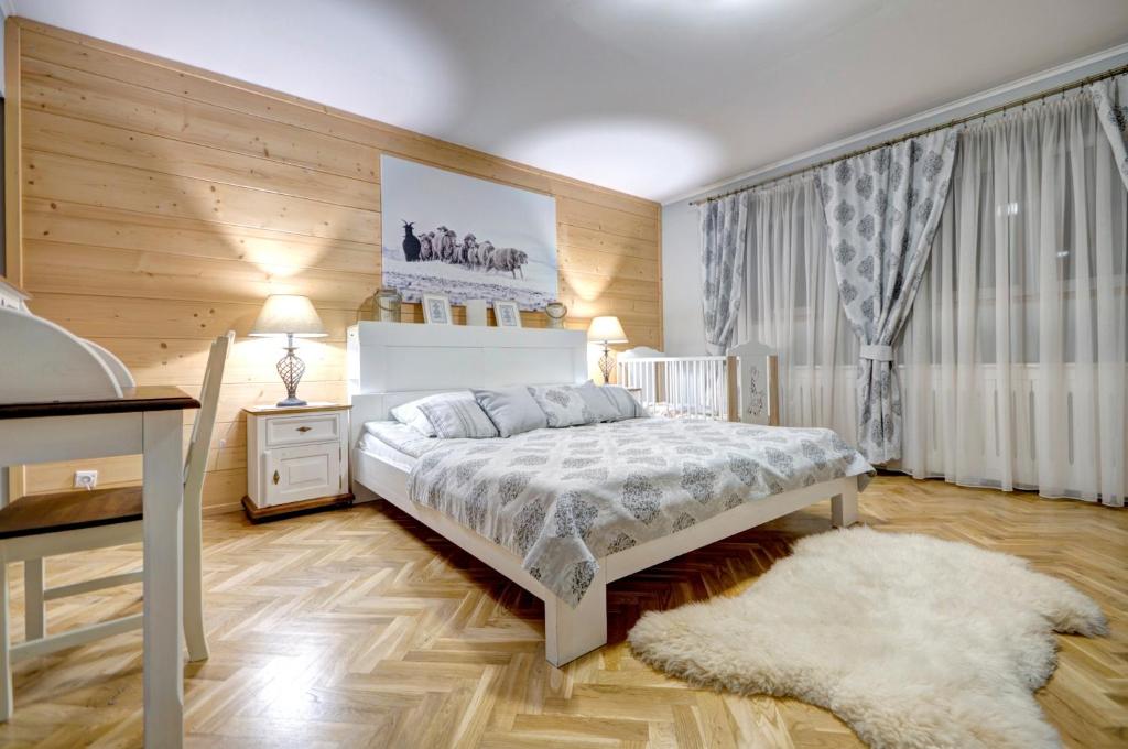 Posteľ alebo postele v izbe v ubytovaní Apartamenty Pod Baranami