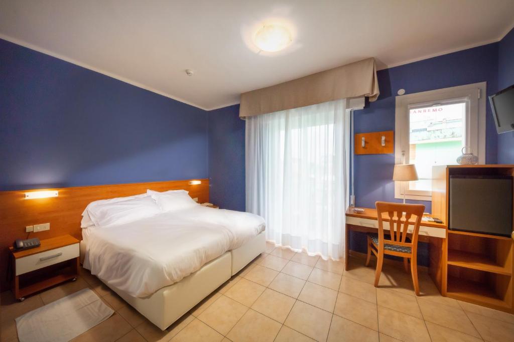 Postel nebo postele na pokoji v ubytování Hotel Verona