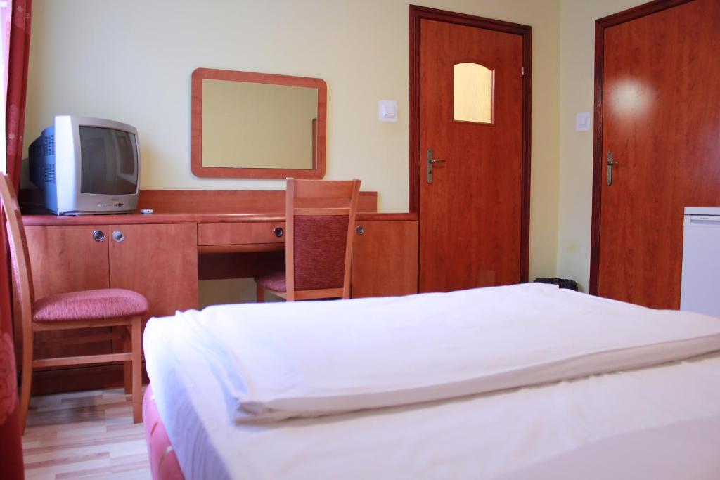 Postel nebo postele na pokoji v ubytování City Hostel