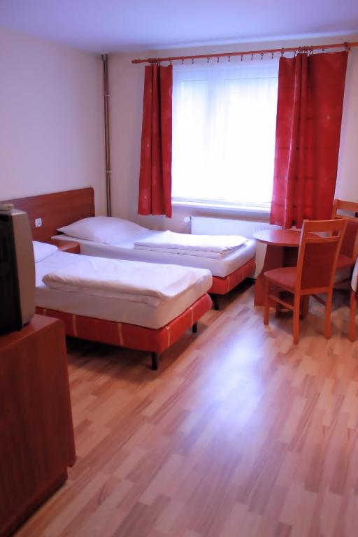 Postel nebo postele na pokoji v ubytování City Hostel