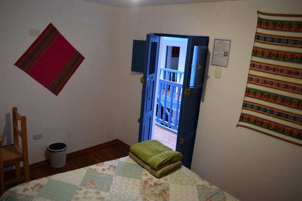 Postel nebo postele na pokoji v ubytování Carlos Guest House 3 Cusco