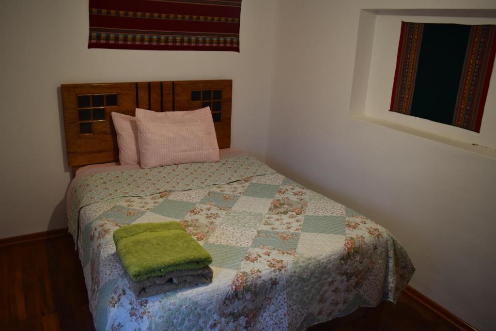 Postel nebo postele na pokoji v ubytování Carlos Guest House 3 Cusco