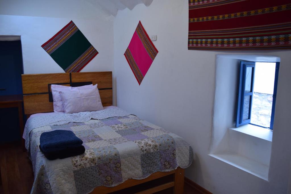 Postel nebo postele na pokoji v ubytování Carlos Guest House 3 Cusco
