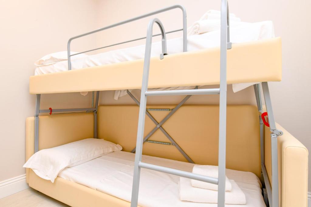 Postel nebo postele na pokoji v ubytování Hotel Oliveto