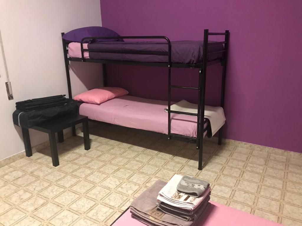 Łóżko lub łóżka w pokoju w obiekcie Villa Vacanze Giuseppe