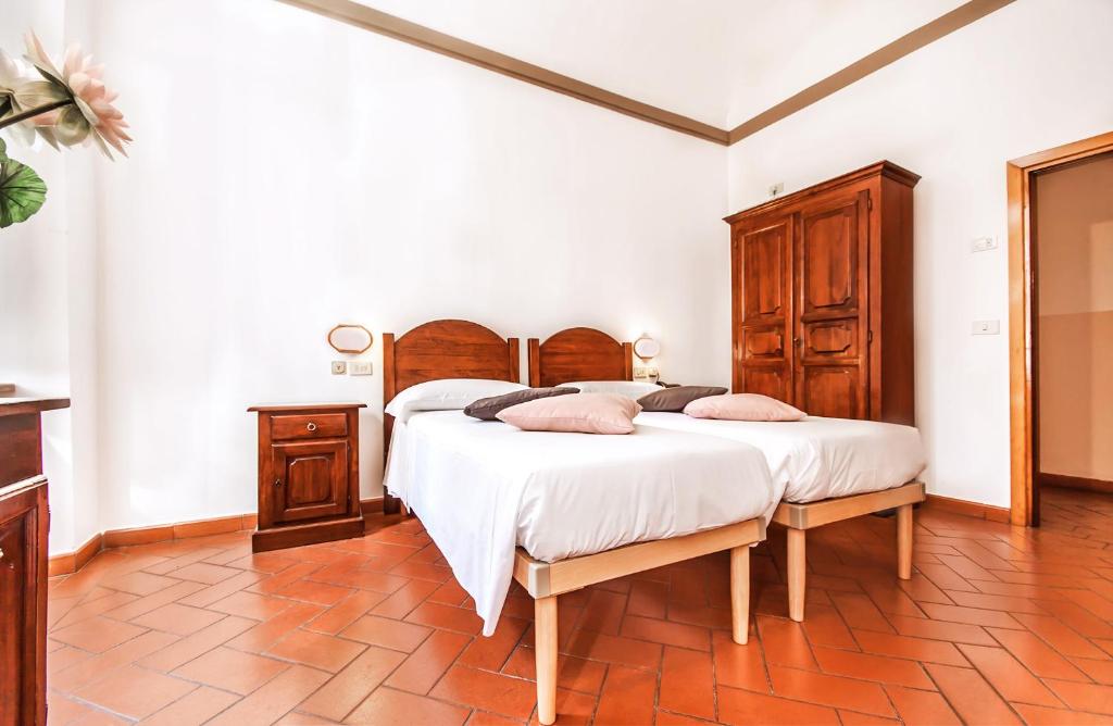 Postel nebo postele na pokoji v ubytování Hotel Costantini