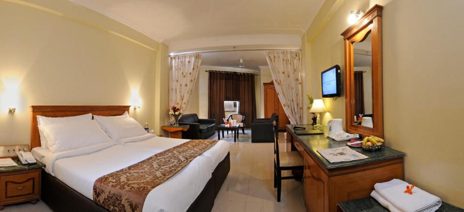 Postel nebo postele na pokoji v ubytování Hotel Pushp Villa Agra Taj East Gate