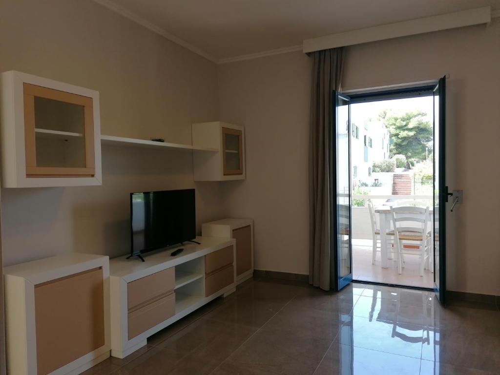TV a/nebo společenská místnost v ubytování Hotel Residence La Corvetta