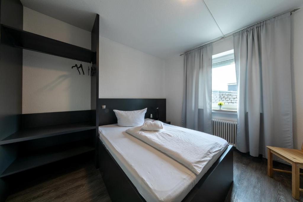 Postel nebo postele na pokoji v ubytování Hotel Central