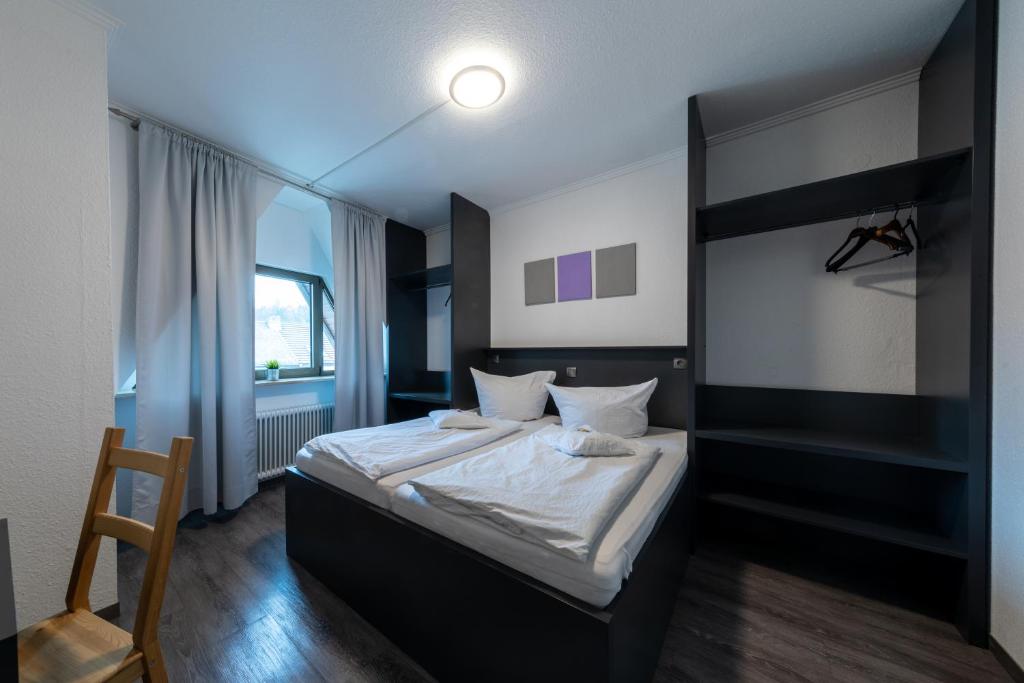 Postel nebo postele na pokoji v ubytování Hotel Central