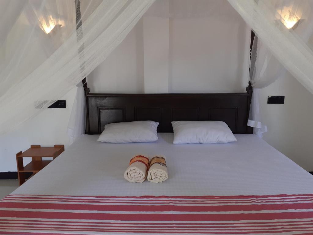Postel nebo postele na pokoji v ubytování Bisandu guesthouse