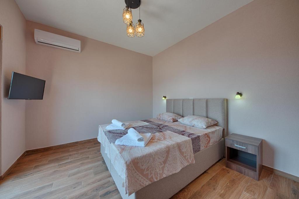 Vuode tai vuoteita majoituspaikassa Apart Hotel XXL Lux