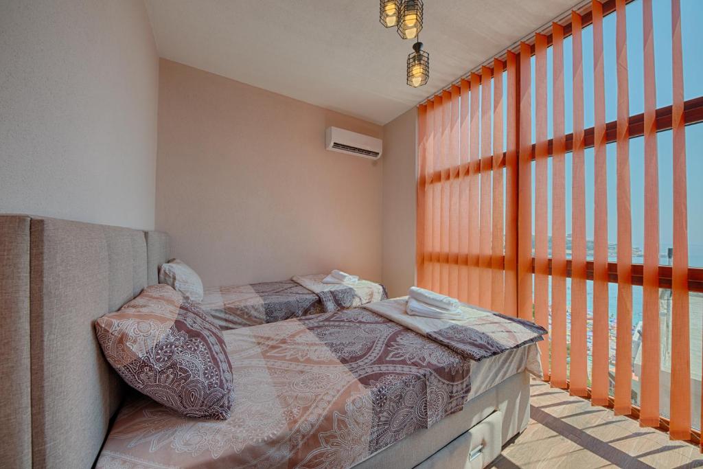 Vuode tai vuoteita majoituspaikassa Apart Hotel XXL Lux