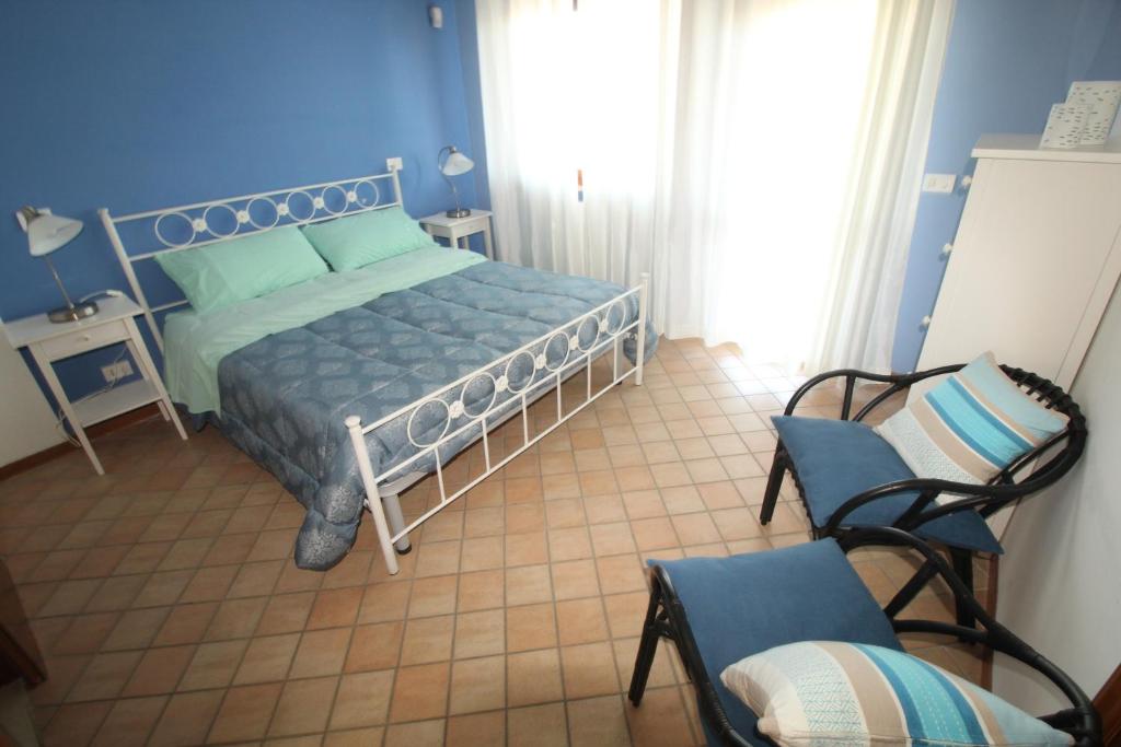 Postel nebo postele na pokoji v ubytování Cala Chiara B&B