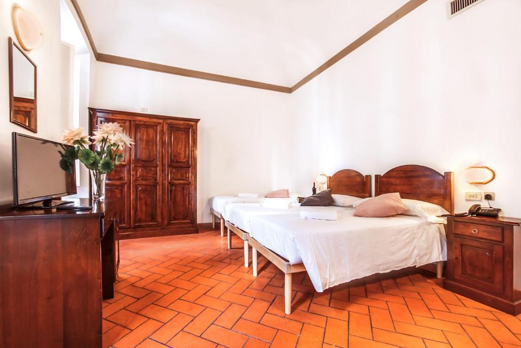 Postel nebo postele na pokoji v ubytování Hotel Costantini