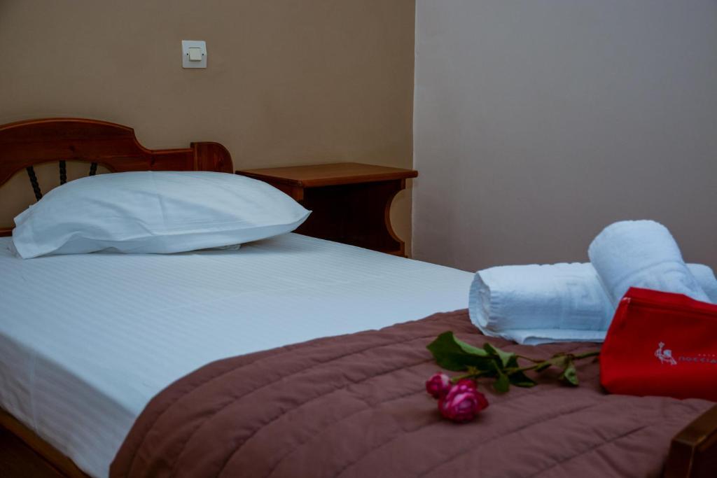 Postel nebo postele na pokoji v ubytování Poseidonio Hotel