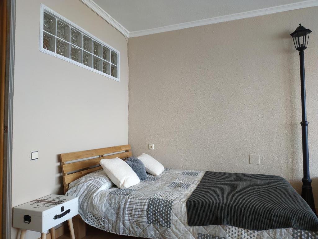 A bed or beds in a room at La calle