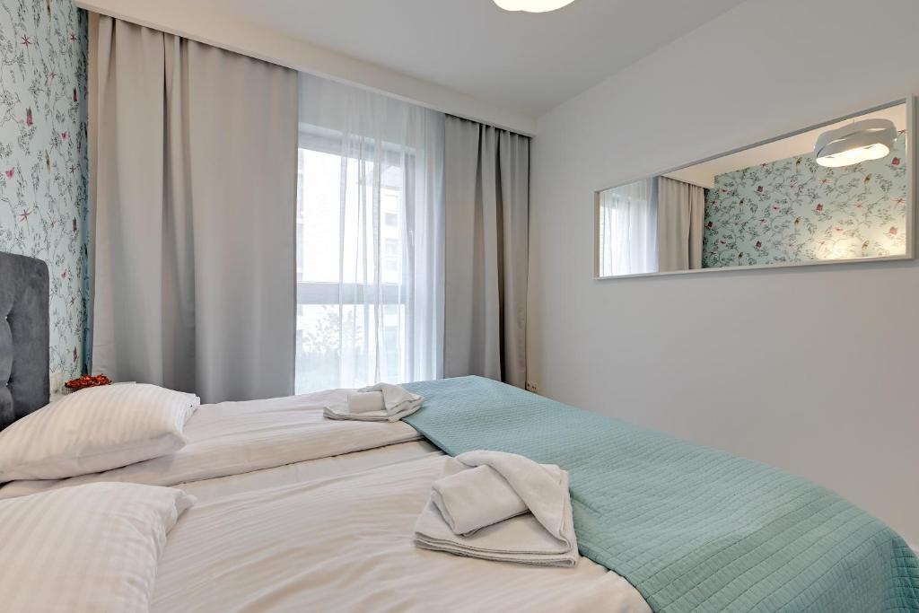 Posteľ alebo postele v izbe v ubytovaní Wave Apartments - Nadmorze