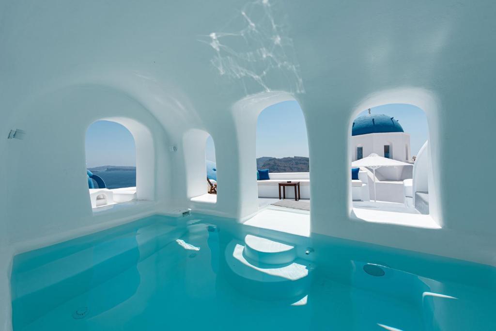 two large swimming pools in a swimming pool at Oia Spirit Boutique Residences in Oia