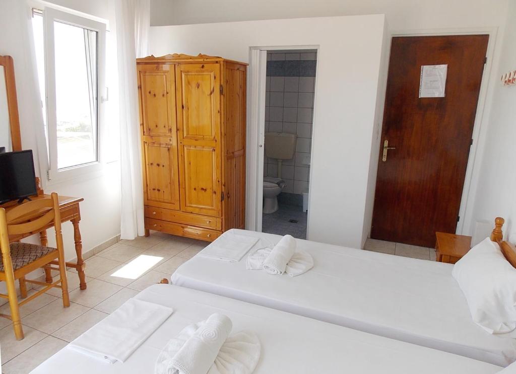 Postel nebo postele na pokoji v ubytování Hotel Sgouridis