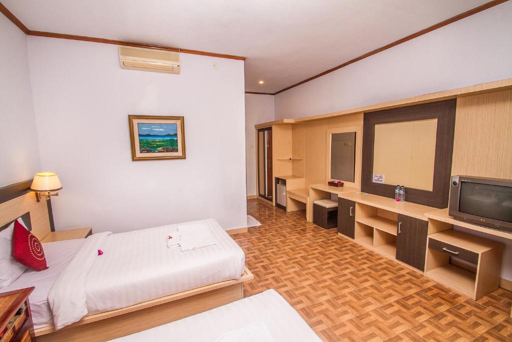 Postel nebo postele na pokoji v ubytování Puri Saron Hotel Madangan - Gianyar