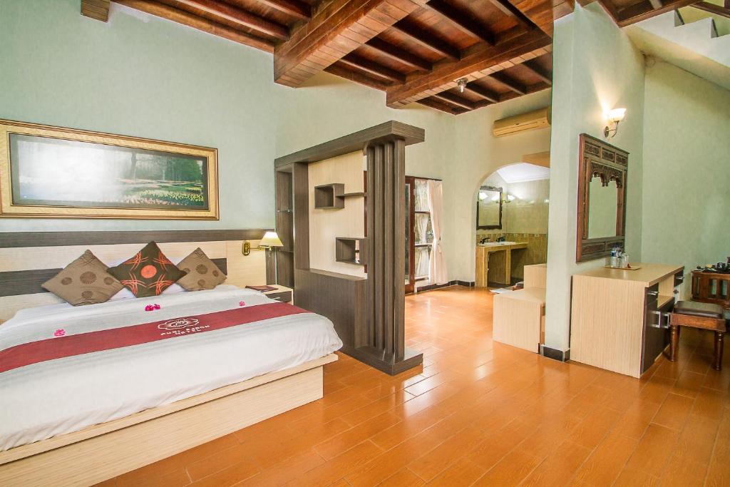 Postel nebo postele na pokoji v ubytování Puri Saron Hotel Madangan - Gianyar