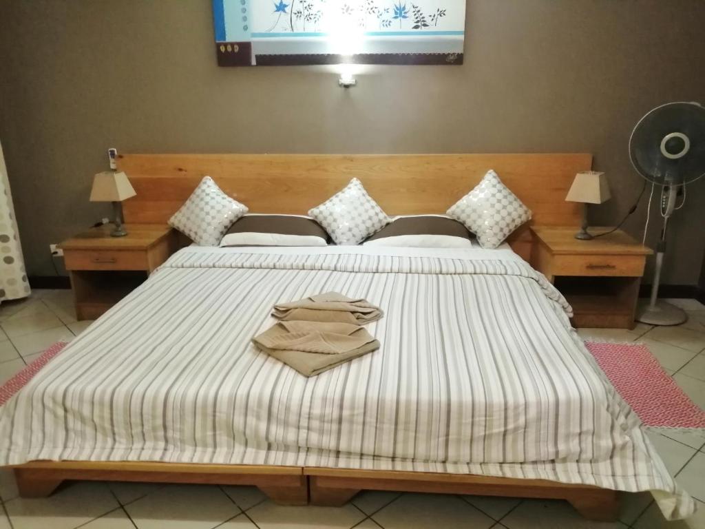 Postel nebo postele na pokoji v ubytování residence les peupliers