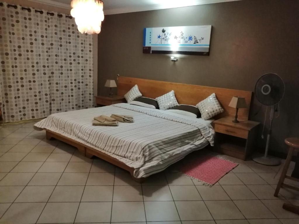 Postel nebo postele na pokoji v ubytování residence les peupliers
