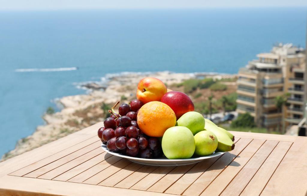 a plate of fruit on top of a table at Rawsheh 51 in Beirut