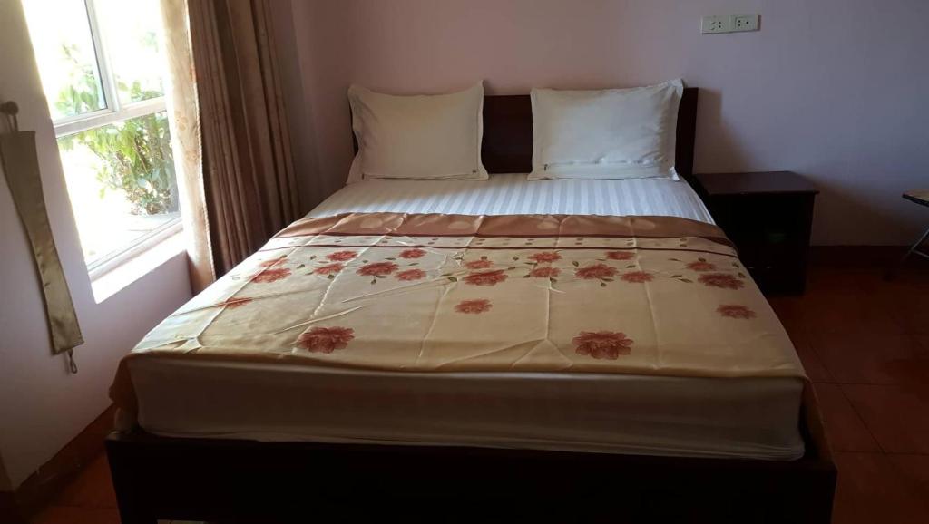 Postel nebo postele na pokoji v ubytování Hai Duong Guesthouse