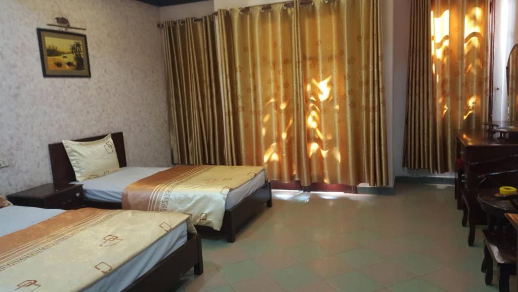 Postel nebo postele na pokoji v ubytování Hai Duong Guesthouse