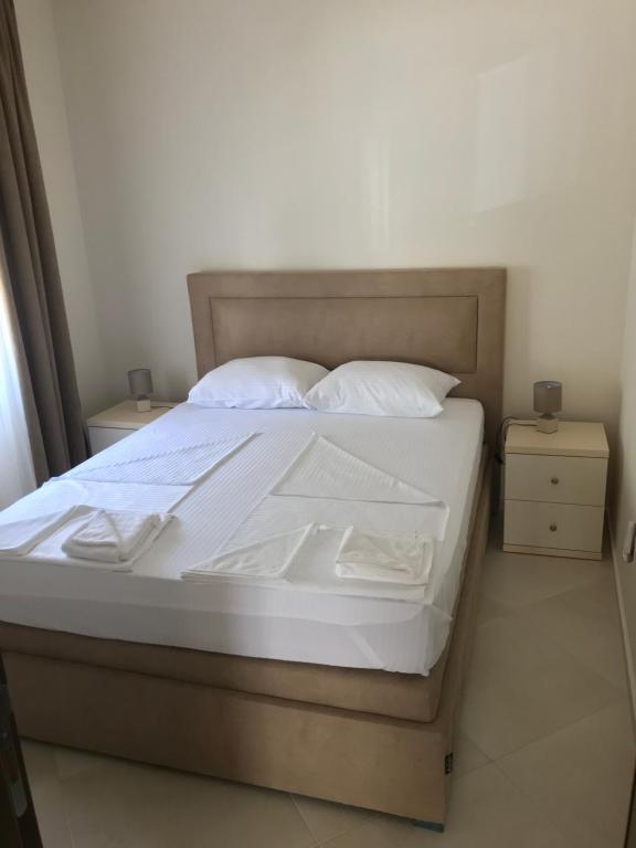 Postel nebo postele na pokoji v ubytování APARTMENTS TOMIĆ
